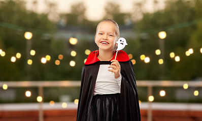 Image showing girl in costume of dracula with cape on halloween