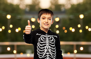 Image showing boy in halloween skeleton costume shows thumbs up