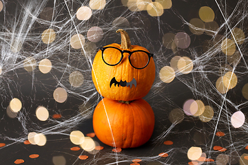 Image showing halloween pumpkins with glasses, bat and spiderweb