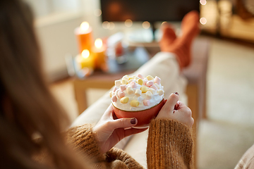 Image showing woman with cream and marshmallow on halloween