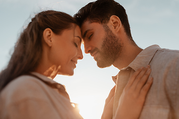 Image showing happy couple with closed eyes outdoors