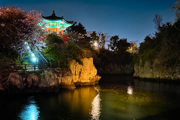 Image showing Yongyeon Pond with Yongyeon Pavilion illuminated at night, Jeju islands, South Korea