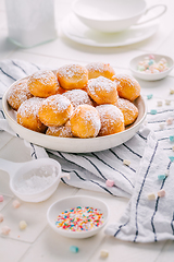 Image showing Cottage cheese donuts balls with sugar in a bowl. Healthy curd dessert.