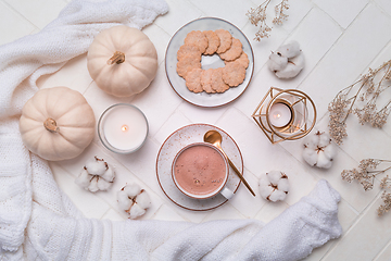 Image showing Hot chocolate and cocoa, autumn and winter still life with candle, cookie and book
