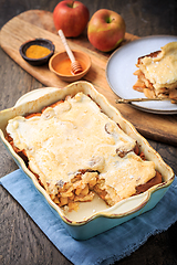 Image showing Homemade bread pudding breakfast casserole with apples and cinnamon