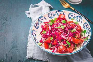 Image showing Winter salad - pickled red cabage salad with radish, tomatoes, onion and  winter purslane