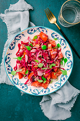 Image showing Winter salad - pickled red cabage salad with radish, tomatoes, onion and  winter purslane