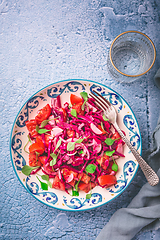 Image showing Winter salad - pickled red cabage salad with radish, tomatoes, onion and  winter purslane