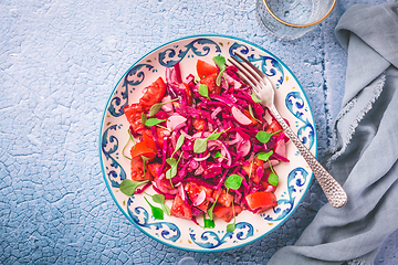 Image showing Winter salad - pickled red cabage salad with radish, tomatoes, onion and  winter purslane