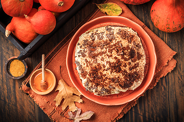 Image showing Homemade pumpkin cake with apples and fresh cheese icing