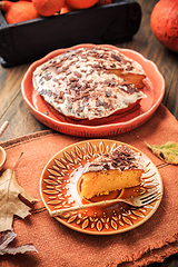 Image showing Homemade pumpkin cake with apples and fresh cheese icing