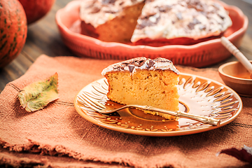 Image showing Homemade pumpkin cake with apples and fresh cheese icing