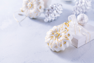 Image showing Christmas ornaments in snowy white. 