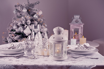 Image showing Festive  Christmas table place setting with silverware, candles 