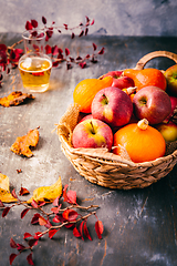 Image showing Autumn composition with pumpkins, autumn leaves, red apples and apple cider