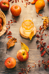 Image showing Apple cider - autumn composition with pumpkins, autumn leaves, red apples 