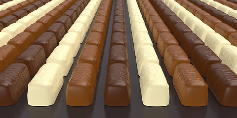 Image showing Dark, milk and white chocolate pralines