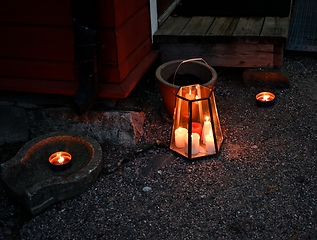 Image showing outdoor Christmas candles at the doorstep of a Finnish house