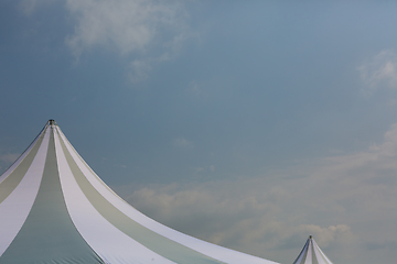 Image showing The dome of a traveling circus against the sky with clouds in a provincial town.