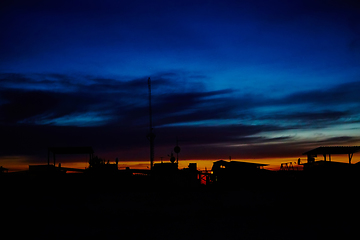 Image showing Silhouettes of houses in the sunset