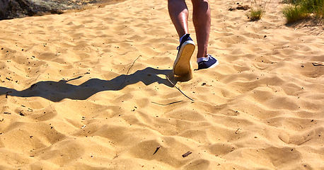 Image showing Close up fashion image of man walking alone 