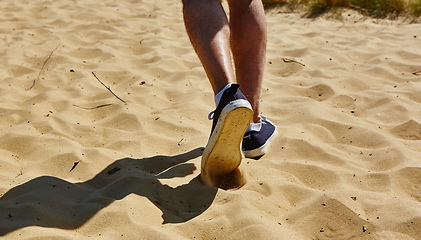 Image showing Close up fashion image of man walking alone 