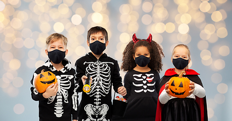 Image showing children in halloween costumes and reusable masks