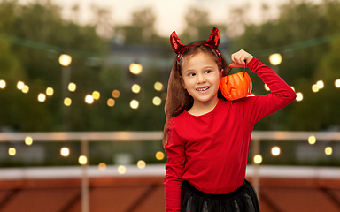 Image showing girl in halloween costume with jack-o-lantern
