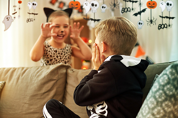 Image showing kids in halloween costumes having fun at home