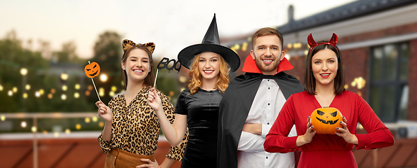 Image showing friends in halloween costumes at roof top party