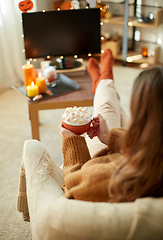 Image showing woman with cream and marshmallow on halloween