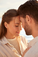 Image showing happy couple with closed eyes on summer beach