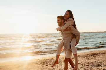 Image showing happy couple having fun on summer beach