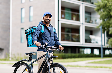 Image showing indian delivery man with bag and bicycle in city