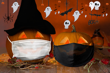 Image showing carved pumpkins or jack-o-lanterns in masks