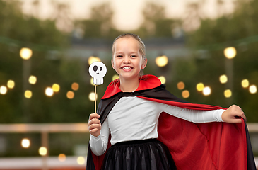 Image showing girl in costume of dracula with cape on halloween