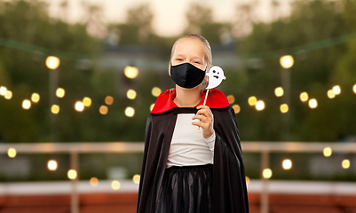 Image showing girl in mask and costume of dracula on halloween