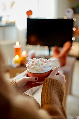 Image showing woman with cream and marshmallow on halloween