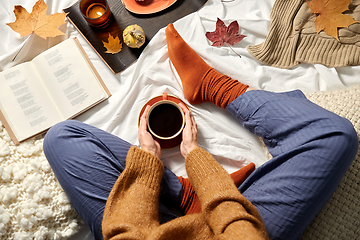 Image showing woman drinking coffee at home in autumn