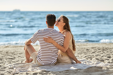 Image showing happy couple hugging on summer beach