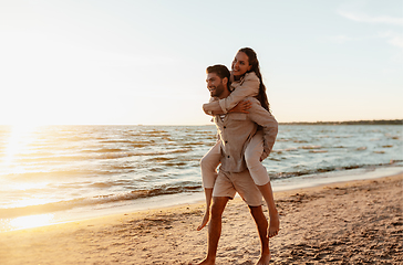 Image showing happy couple having fun on summer beach