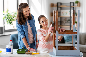 Image showing mother and daughter sanding old table with sponge