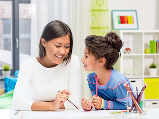 Image showing happy mother and daughter drawing at home