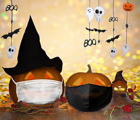 Image showing carved pumpkins or jack-o-lanterns in masks