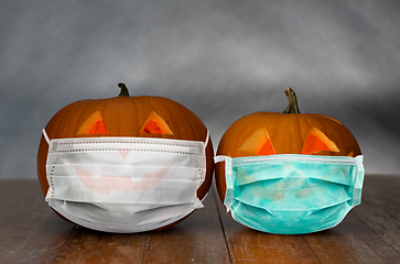 Image showing carved pumpkins or jack-o-lanterns in masks