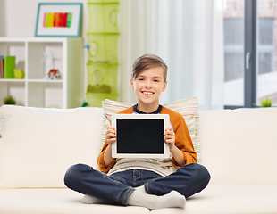 Image showing smiling boy with tablet computer at home