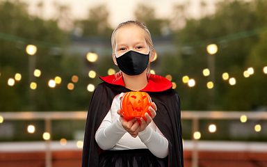 Image showing girl in mask and costume of dracula on halloween