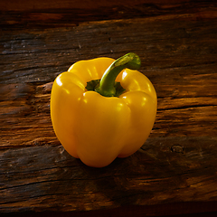 Image showing Fresh yellow sweet peper onwooden background.