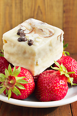 Image showing strawberries and sweet cake on the white plate