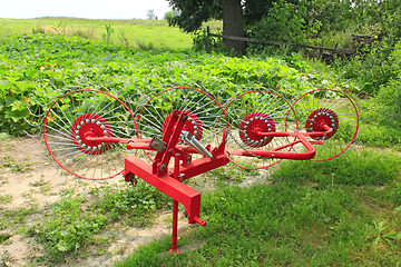 Image showing agricultural tractor equipment to collect the hay